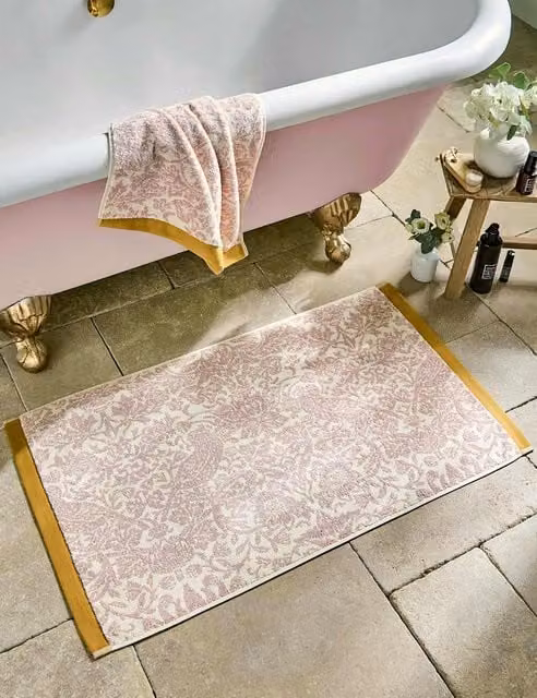 William Morris At Home Strawberry Thief Pure Cotton Floral Bath Mat in Pink and Gold Mix
