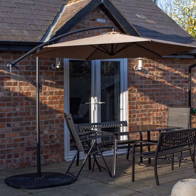 Samuel Alexander 6 Person Dining Set with Glass Table, Benches, Chairs, Beige Banana Parasol and Black Base