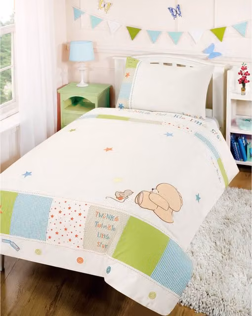 Forever Friends cot duvet cover set in blue, white, green and orange with star design