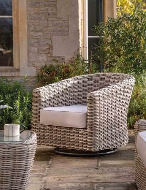Gallery Direct Ragusa 360 degree swivel outdoor tub chair in natural polyrattan with beige cushions and armrests