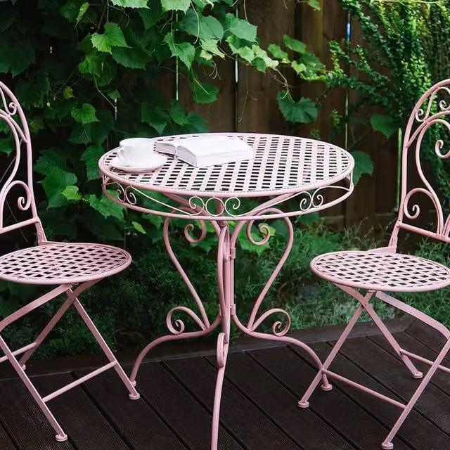 Wyld and Coco Evergarden Pink Powder-Coated Iron Bistro Table with Scrollwork – 1
