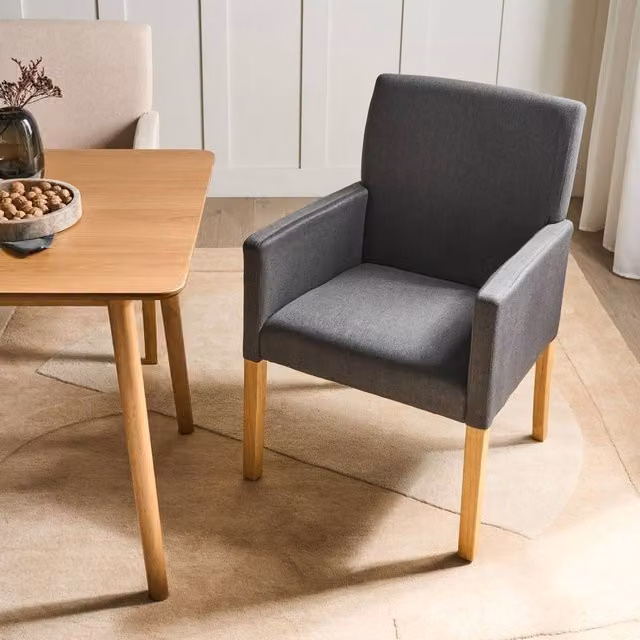 Wyld and Coco Grey Fabric Dining Chair with Armrests and Rubberwood Legs – 1