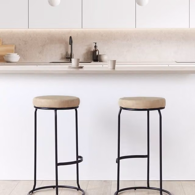 Wyld and Coco Set of 2 Beige Faux Leather Armless Bar Stools with Black Metal Legs