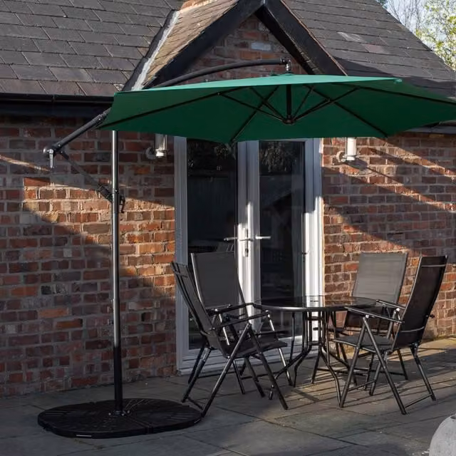 Samuel Alexander Outdoor 4 Person Round Glass Top Garden Dining Table and Chairs Set with Green Banana Parasol and Base in Black