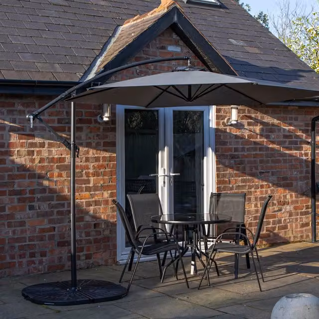 Samuel Alexander Modern 4 Person Glass Top Garden Dining Set with Grey Parasol in Black and Grey