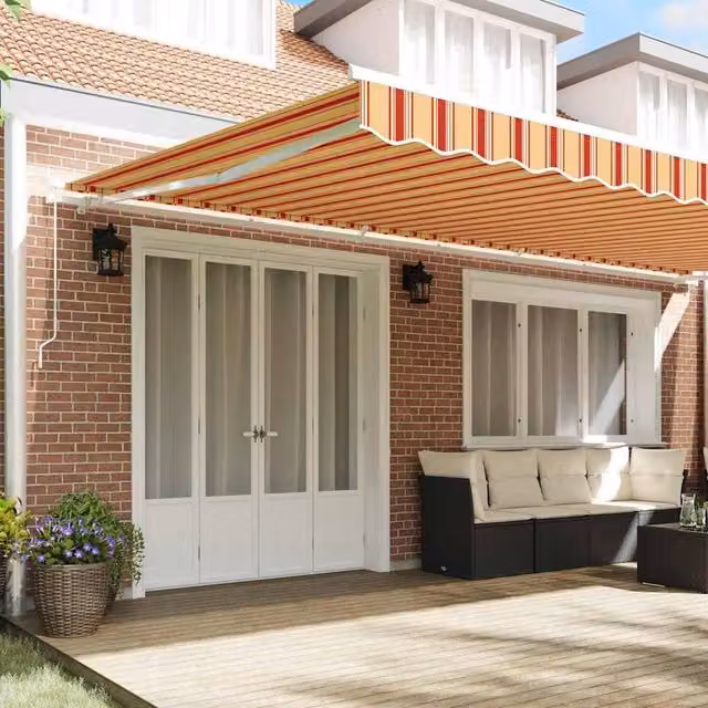 Berkfield Home Manual Retractable Folding Arm Awning in Yellow and Orange Striped Acrylic Fabric, W: 600 cm, D: 300 cm