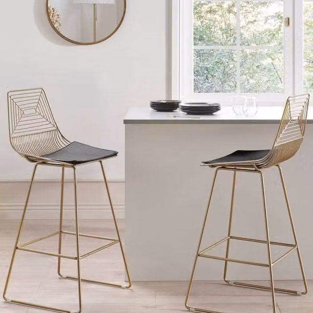 Wyld and Coco Set of 2 Gold Metal Dining Chairs with Faux Leather Seats