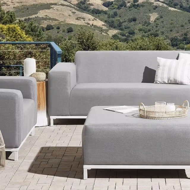 Wyld Haus Square Ottoman in Light Grey Polyester with White Aluminium Legs – 1