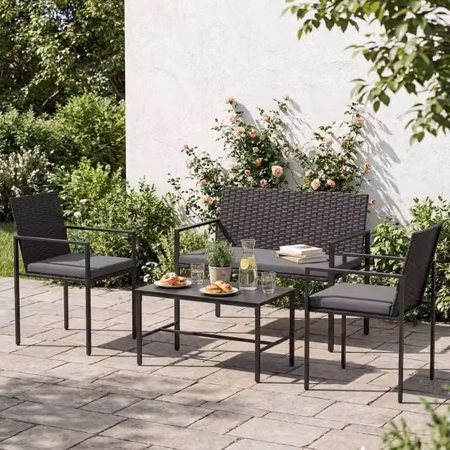 Costway 4-Piece Grey Polyrattan Patio Furniture Set with 2-Seater Sofa, Armchairs, Coffee Table and Upholstered Cushions