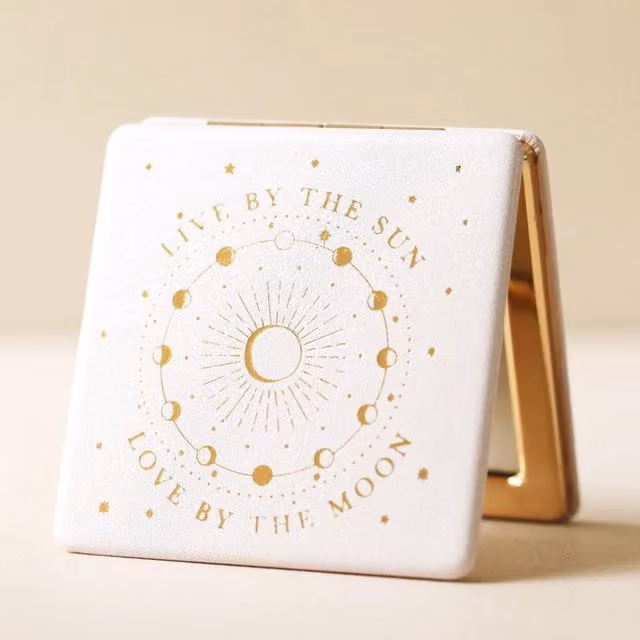 Lisa Angel Live by the Sun Compact Mirror in Gold and Off-White