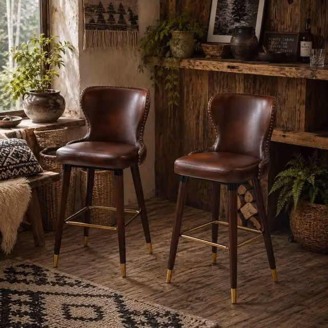 Wyld Haus Halotti Brown Faux Leather Bar Stools Set of 2 with Gold Accents and Rubberwood Legs, H 101 cm x W 53 cm x D 52 cm
