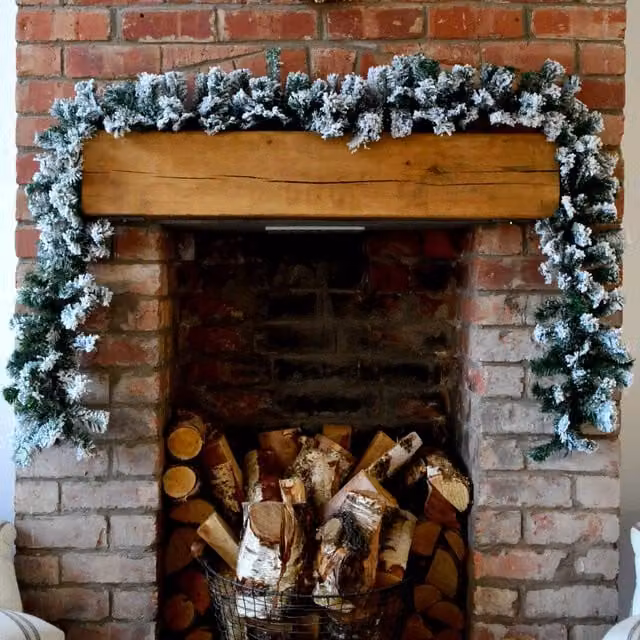 Premier Decorations 2.7m Snow Flocked Pine Christmas Garland in White and Green