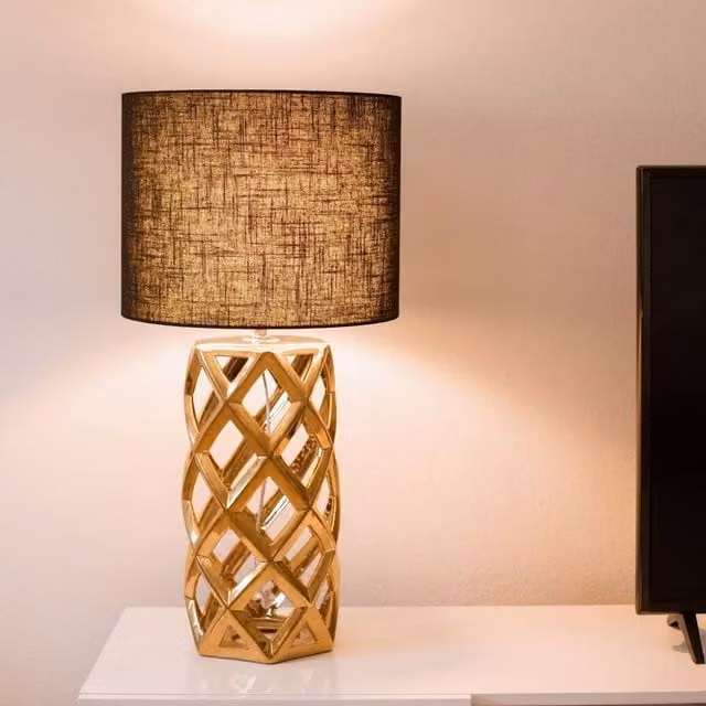 Wyld and Coco Modern Table Lamp with Gold Ceramic Base and Black Fabric Drum Shade – 1