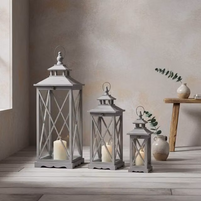 Wyld Haus Set of Three Grey Wooden Tabletop Lanterns with Glass Panels and Rustic Cross Frame Design – 1