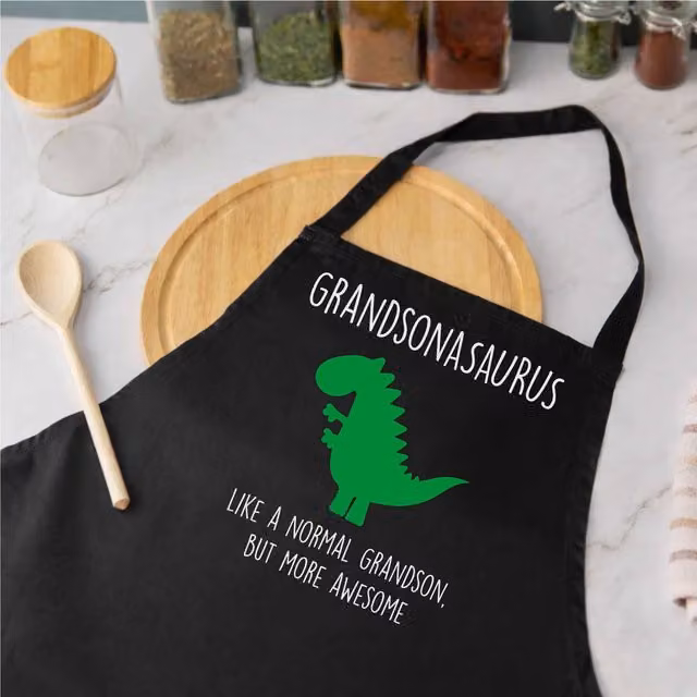 60 SECOND MAKEOVER Men's Grandsonasaurus Dinosaur Apron in Black