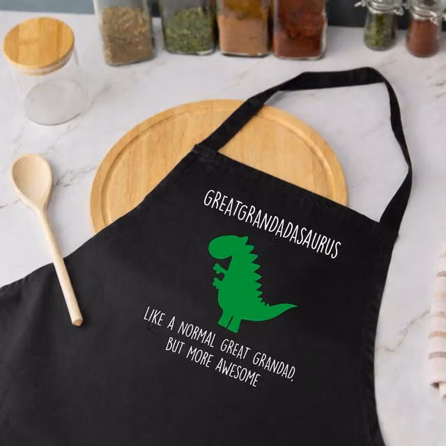 60 SECOND MAKEOVER Men's Great Grandad Dinosaur Apron in Black – 1