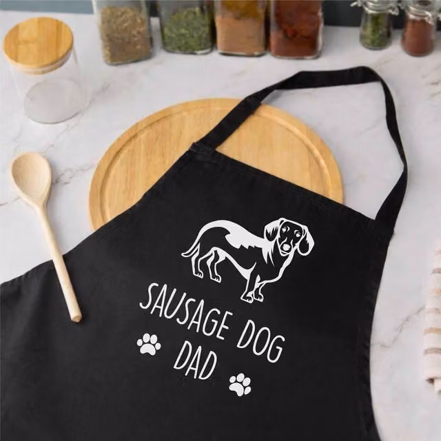 60 SECOND MAKEOVER Men's Sausage Dog Dad Apron in Black