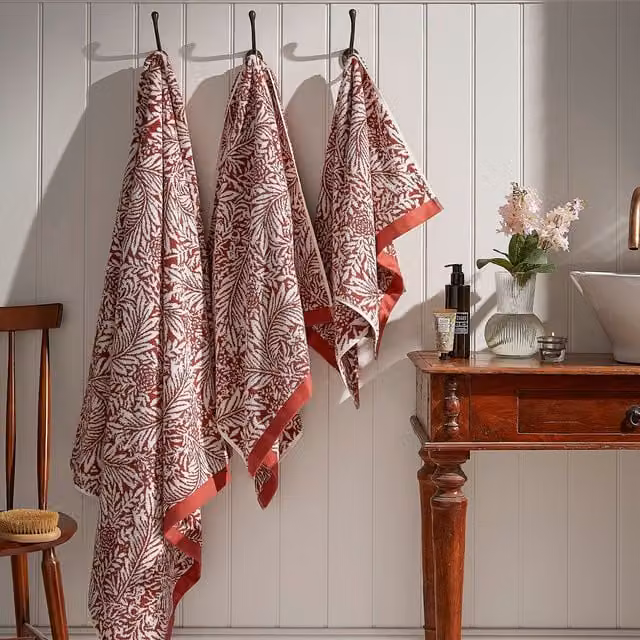William Morris At Home Larkspur Floral Cotton Towel with Border in Orange, Beige and Red