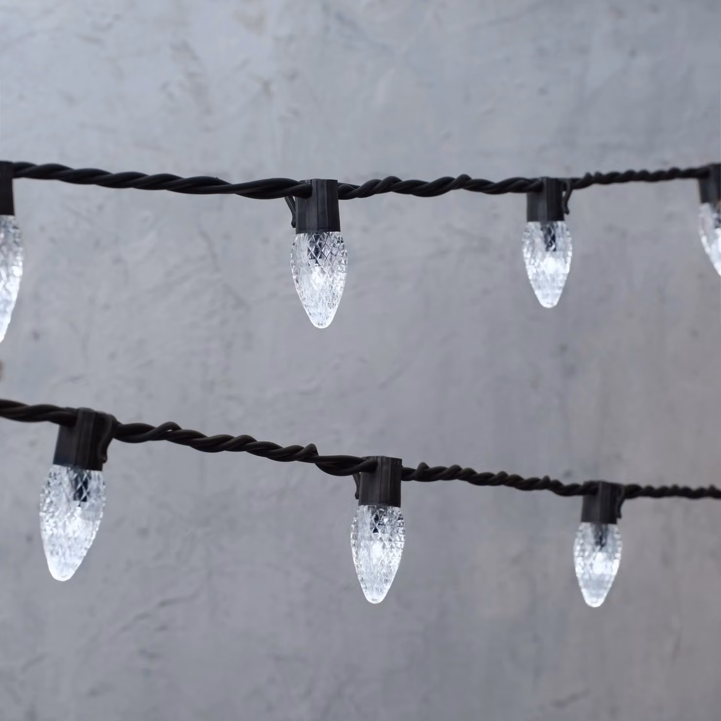 Lights4fun Plus Connectable Warm White LED C9 Icicle Fairy Lights with Black Cable, 105m