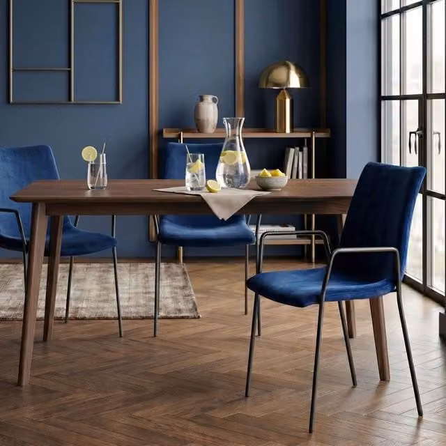 Wyld and Coco Set of 2 Dark Blue Velvet Dining Chairs with Armrests and Metal Legs