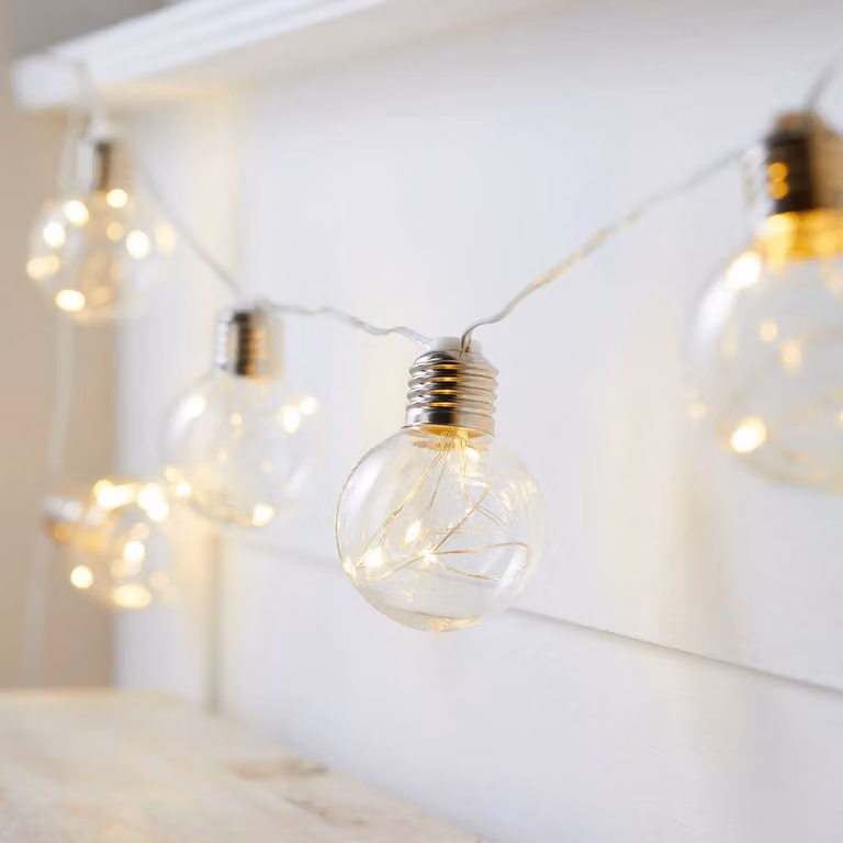 Lights4fun 10 Silver Sphere Micro Battery Festoon String Lights with Warm White Transparent Bulbs