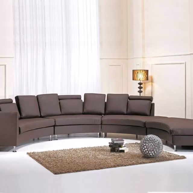 Wyld and Coco Brown Curved Leather 7-Seater Sofa with Adjustable Headrests and Matching Ottoman