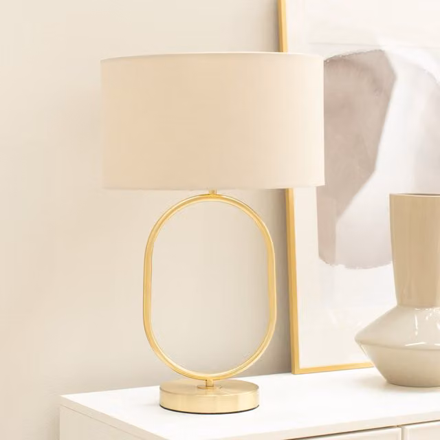 Antonia Brushed Gold Oval Table Lamp with Natural Fabric Drum Shade