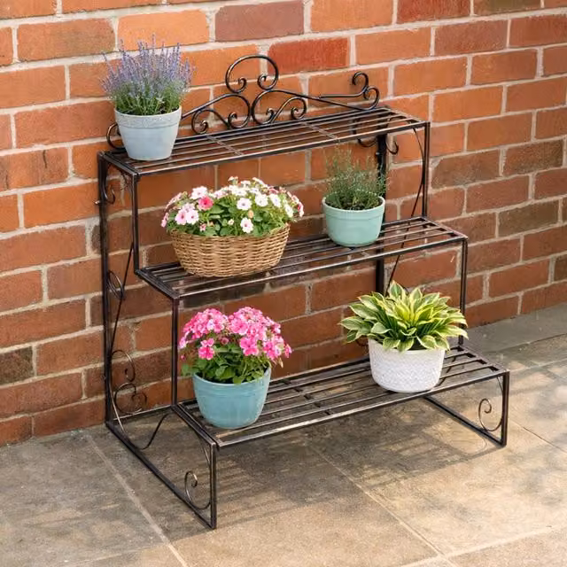 Melody Maison Black and Gold Lacquered Metal Three Tier Plant Theatre Stand