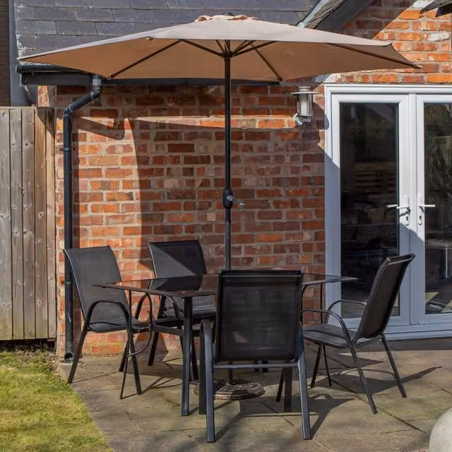 Samuel Alexander 4 Person Rectangular Glass Top Patio Set with Cream Parasol and Base in Black and Beige