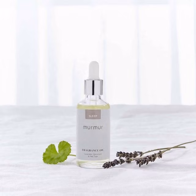 Murmur Sleep Fragrance Oil with Floral Scent in a Transparent Glass Bottle