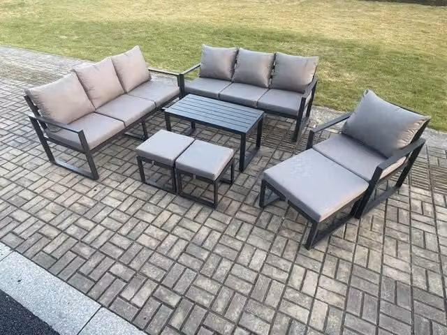 Fimous 7 Piece Powder Coated Aluminium Garden Furniture Set in Dark Grey with Upholstered Cushions, 3 Seater Sofa, Armchair and 3 Ottomans