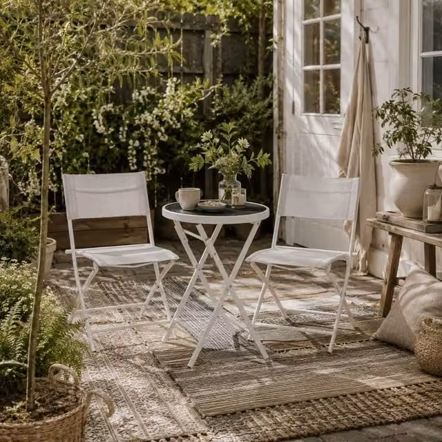 Wyld Haus Lafiyo White 3 Piece Outdoor Bistro Set with Round Glass Table and Folding Chairs – 1