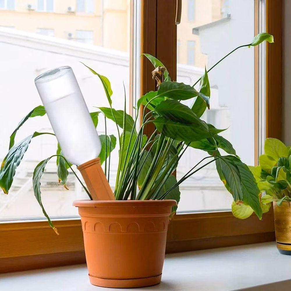 KORVIXA 4-Piece Brown Terracotta Plant Watering Devices – 3