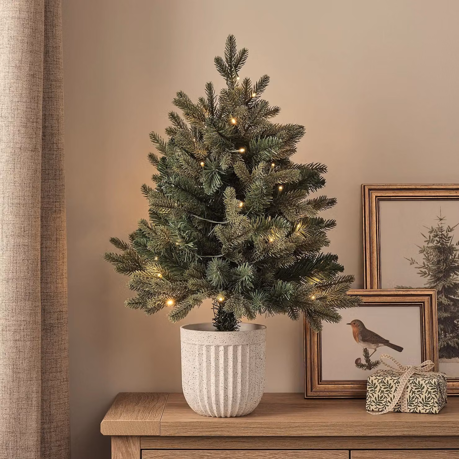 Lights4fun.co.uk 60 cm Pre-Lit Green Outdoor Christmas Tree with Warm White Lights and White Pot