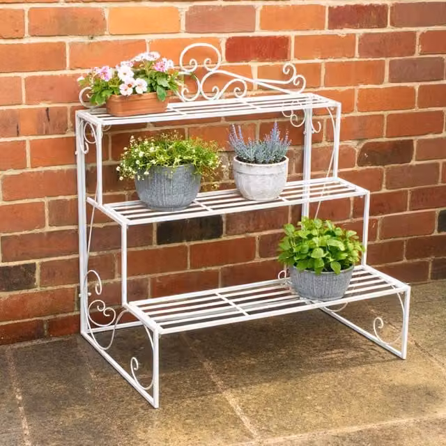 Melody Maison Three Tier White Lacquered Metal Plant Theatre Stand with Vintage Distressed Finish – 1