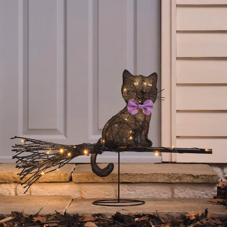Lights4fun Cat on a Broom Outdoor LED Halloween Decoration in Yellow, Purple, Black and White