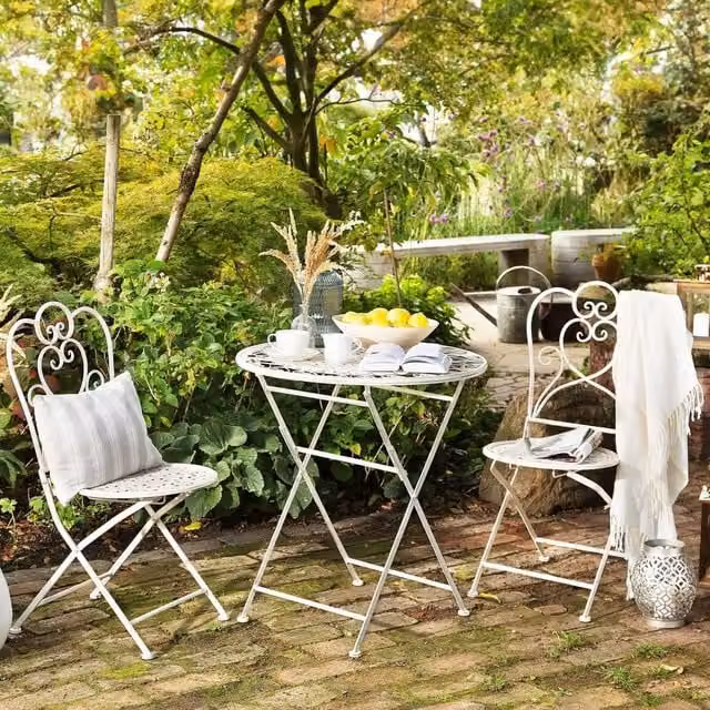 Wyld and Coco Set of 2 Beige Lacquered Metal Garden Bistro Chairs with Shabby Chic Design