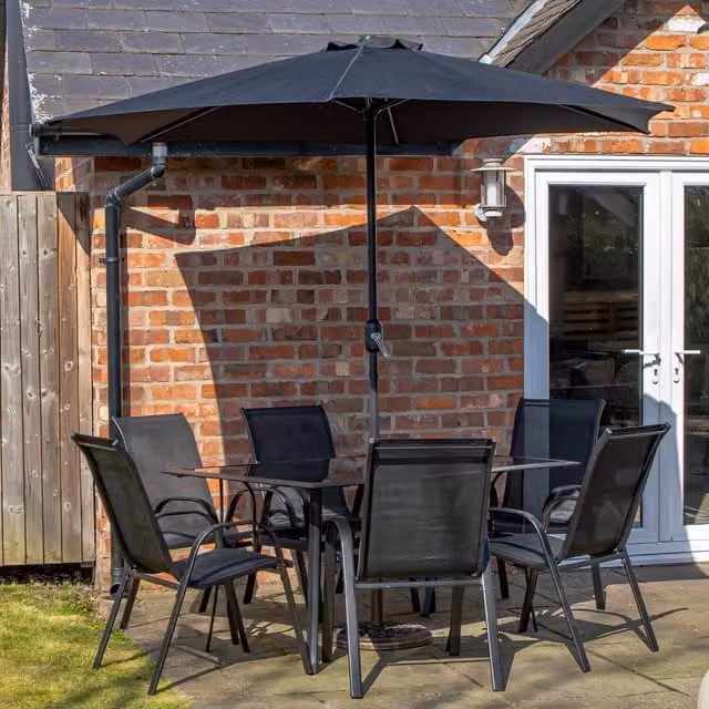 Samuel Alexander 6 Person Rectangular Glass Top Patio Table and Chairs Set with Black Parasol in Black