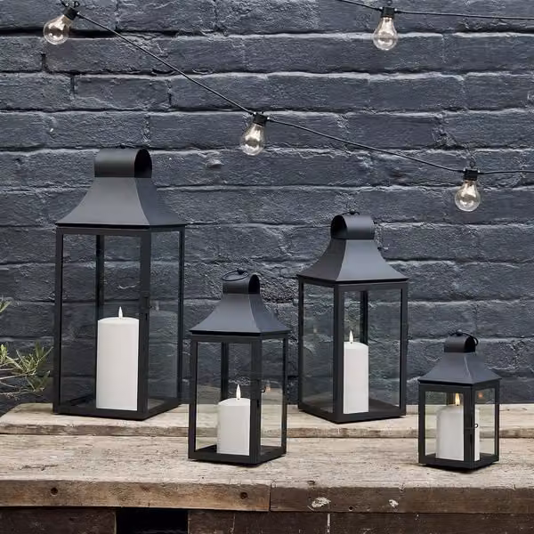 Lights4fun Set of 4 Classic Black Metal Outdoor Garden Lanterns with TruGlow LED Pillar Candles – 1