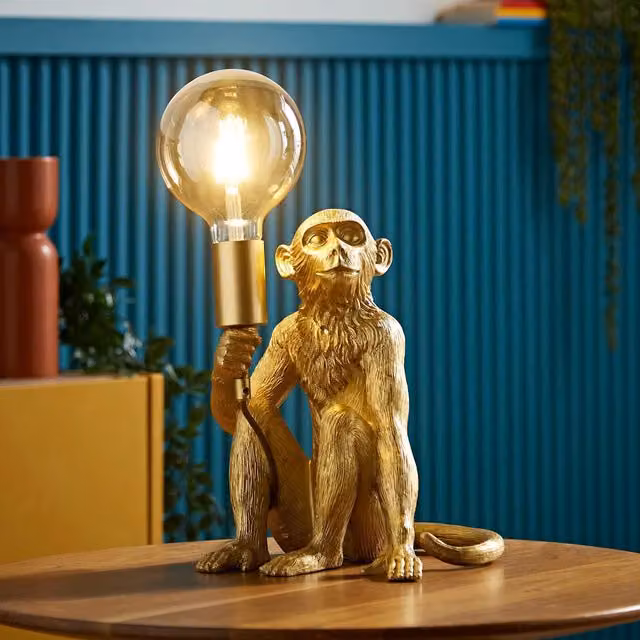 ValueLights George Monkey Table Lamp in Gold and Brass with Glass Globe