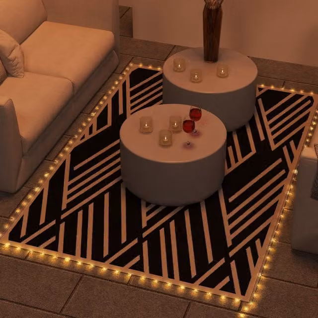 Outsunny Reversible Geometric Outdoor RV Rug with LED String Lights in Black and Brown