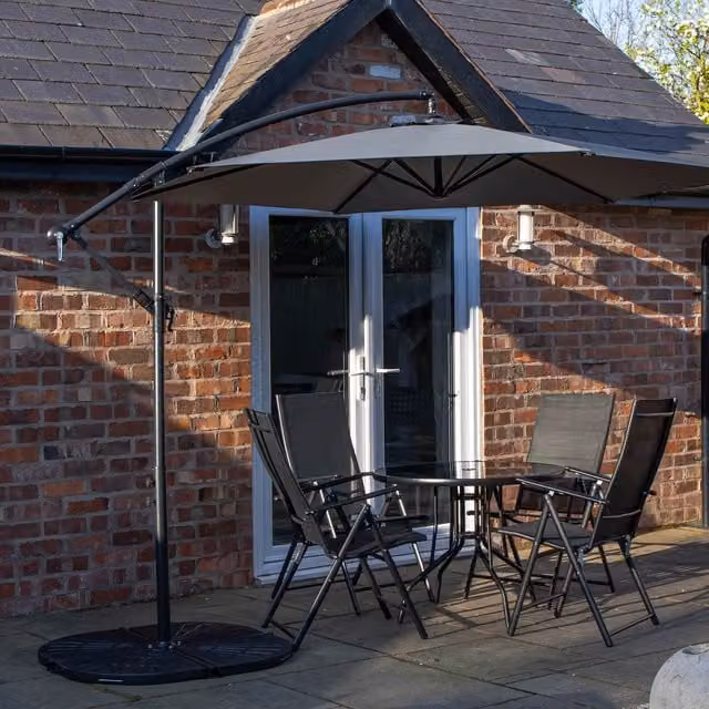 Samuel Alexander 4 Person Glass Top Dining Set with Grey Banana Parasol and Base in Black