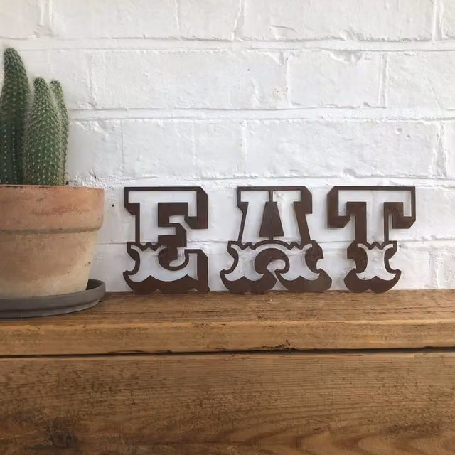 RW Norfolk Rusted EAT Metal Wall Decoration in Brown