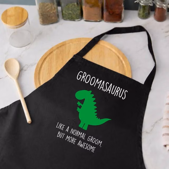 60 Second Makeover Men's Groom Dinosaur Apron in Black