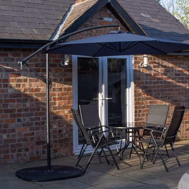 Samuel Alexander 4 Person Round Glass Top Garden Dining Set with Blue Banana Parasol and Base in Black