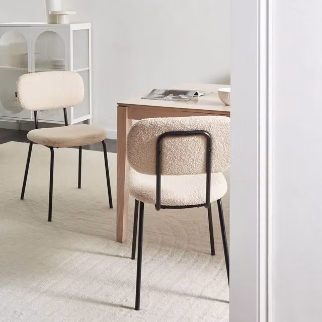 Wyld and Coco Set of 2 Beige Bouclé Dining Chairs with Black Metal Base – 1