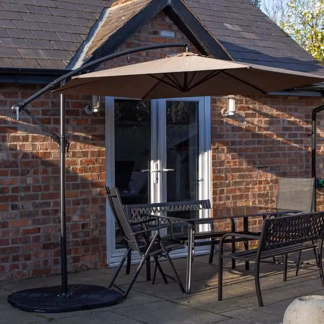 Samuel Alexander 6 Person Dining Set with Glass Table, Benches, Chairs, Beige Banana Parasol and Black Base