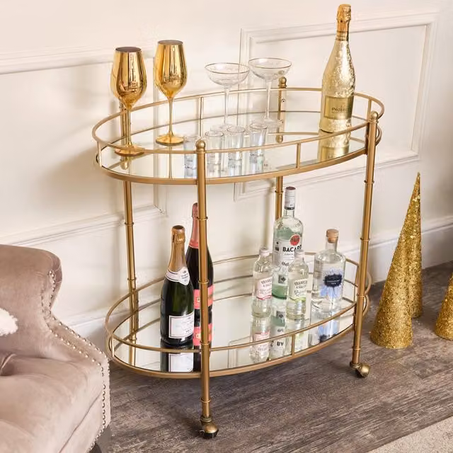 Melody Maison Gold Mirrored Oval Drinks Trolley with Glass Tiers and Castors