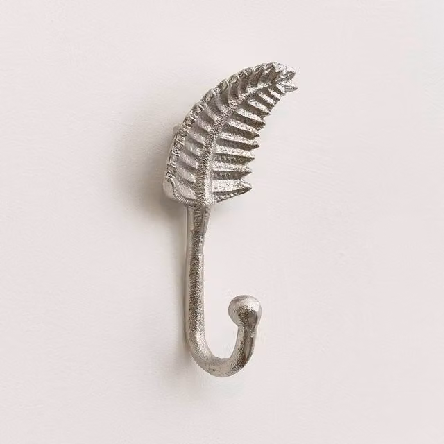 Melody Maison Silver Curved Leaf Wall Hook in Metallic Silver Metal