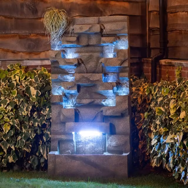 Primrose Brown Stone Tiered Cascade Water Wall and Planter with LED Lights
